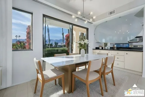a kitchen with stainless steel appliances white cabinets and a sink