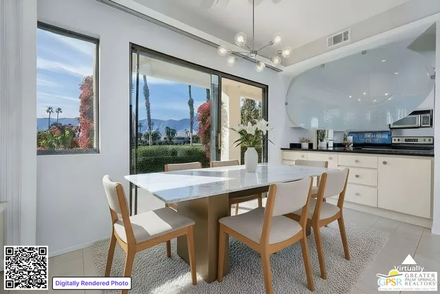 a dining room with furniture and window