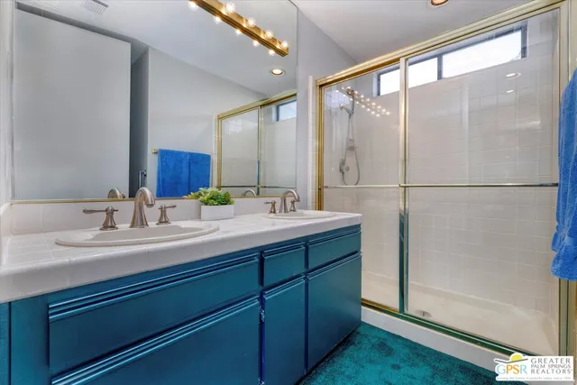 a view of a bathroom with a sink and a window