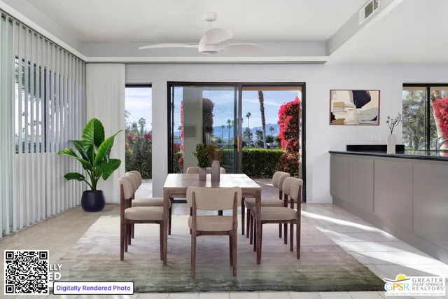a dining room with furniture potted plants and wooden floor
