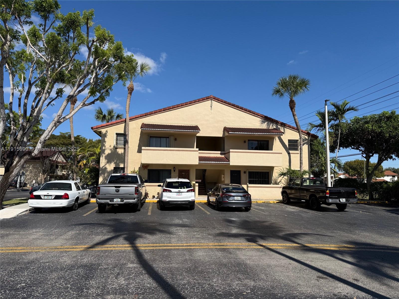 6225 Southwest 136th Court, Unit C209 Miami, FL 33183 - Photo 1 of 13 a car parked in front of a building