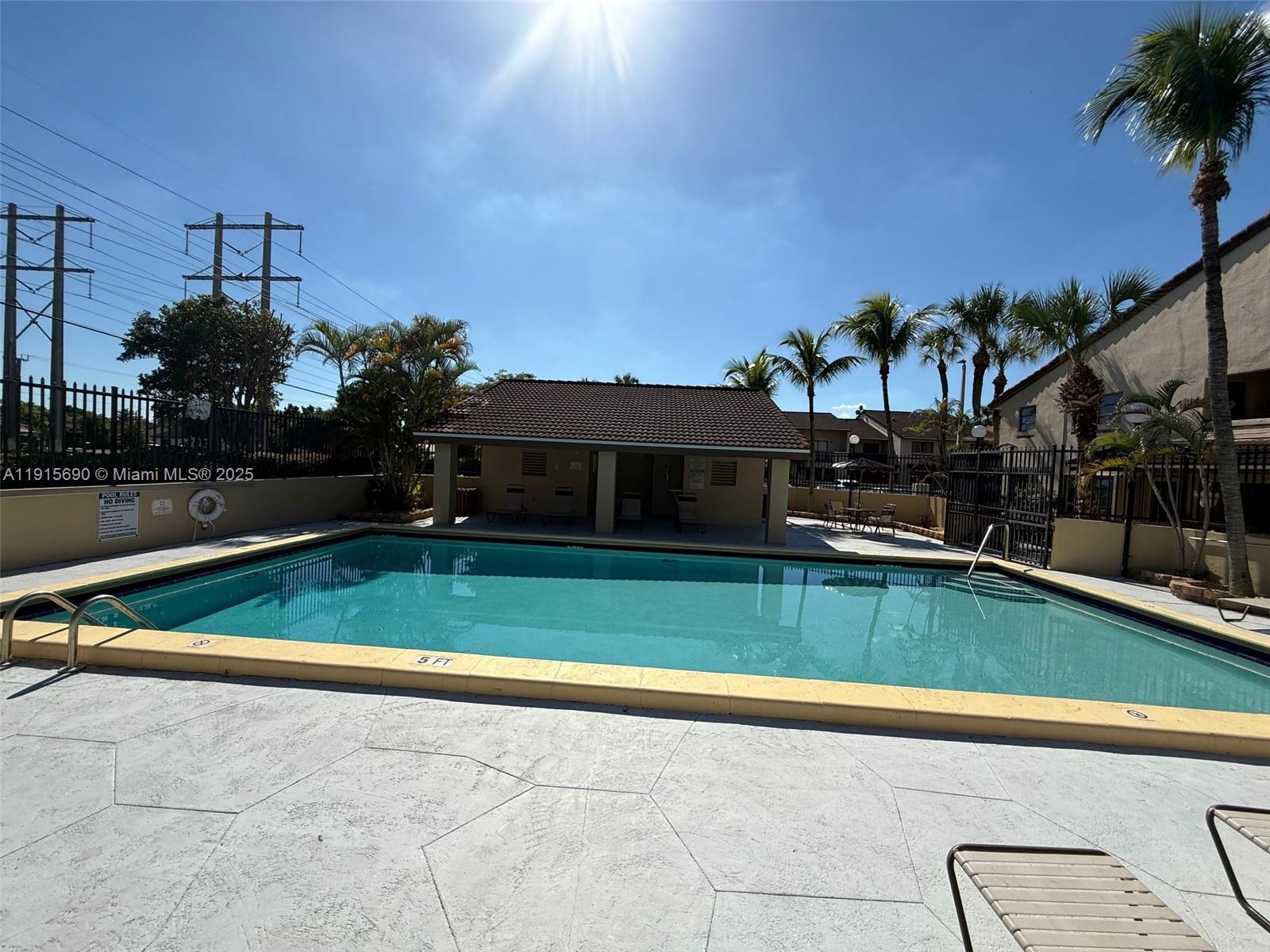 6225 Southwest 136th Court, Unit C209 Miami, FL 33183 - Photo 13 of 13 a view of a house with a swimming pool