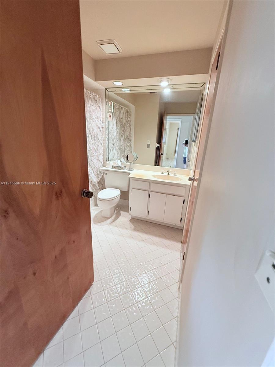 6225 Southwest 136th Court, Unit C209 Miami, FL 33183 - Photo 7 of 13 a very nice looking room with a chair