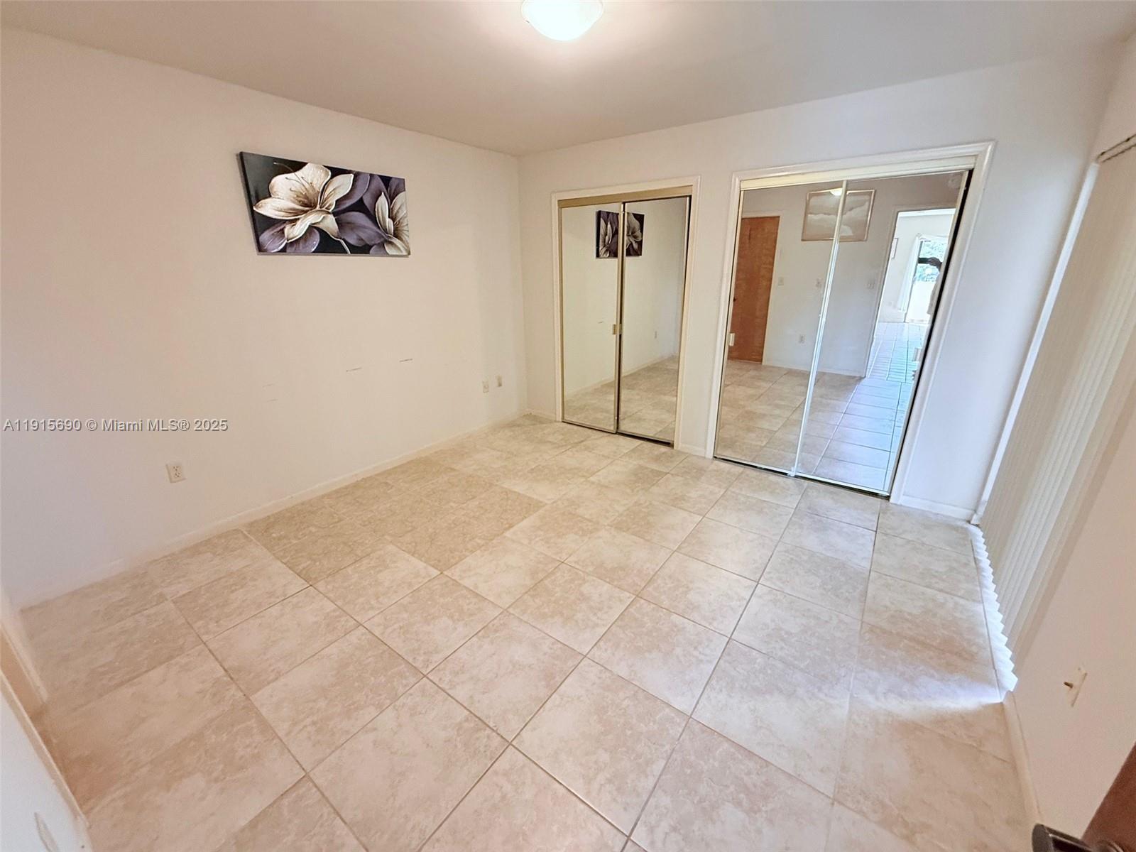 6225 Southwest 136th Court, Unit C209 Miami, FL 33183 - Photo 8 of 13 a view of an empty room