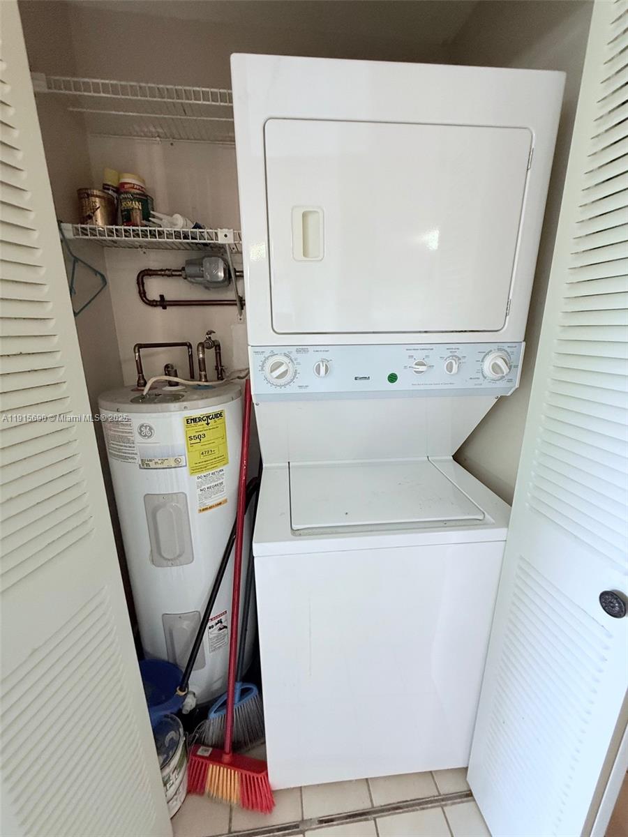 6225 Southwest 136th Court, Unit C209 Miami, FL 33183 - Photo 10 of 13 a utility room with dryer and washer