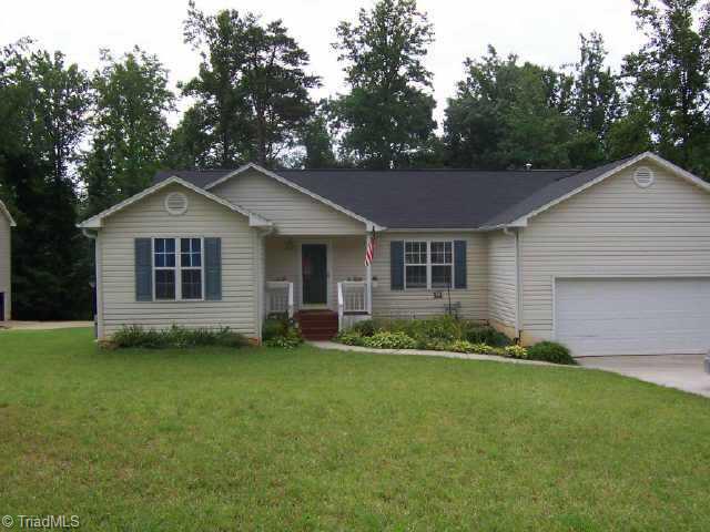 8015 Bartonshire Drive Oak Ridge, NC 27310 - Photo 1 of 1 Exterior Front. House sits back from the road..