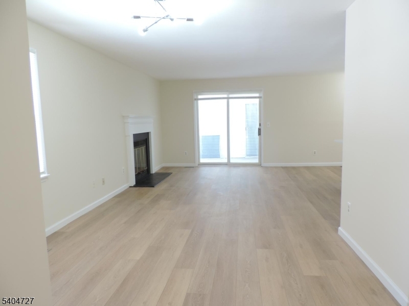 27 Alexandria Way, Unit 27 Bernards, NJ 07920 - Photo 5 of 19 a view of an empty room with a window