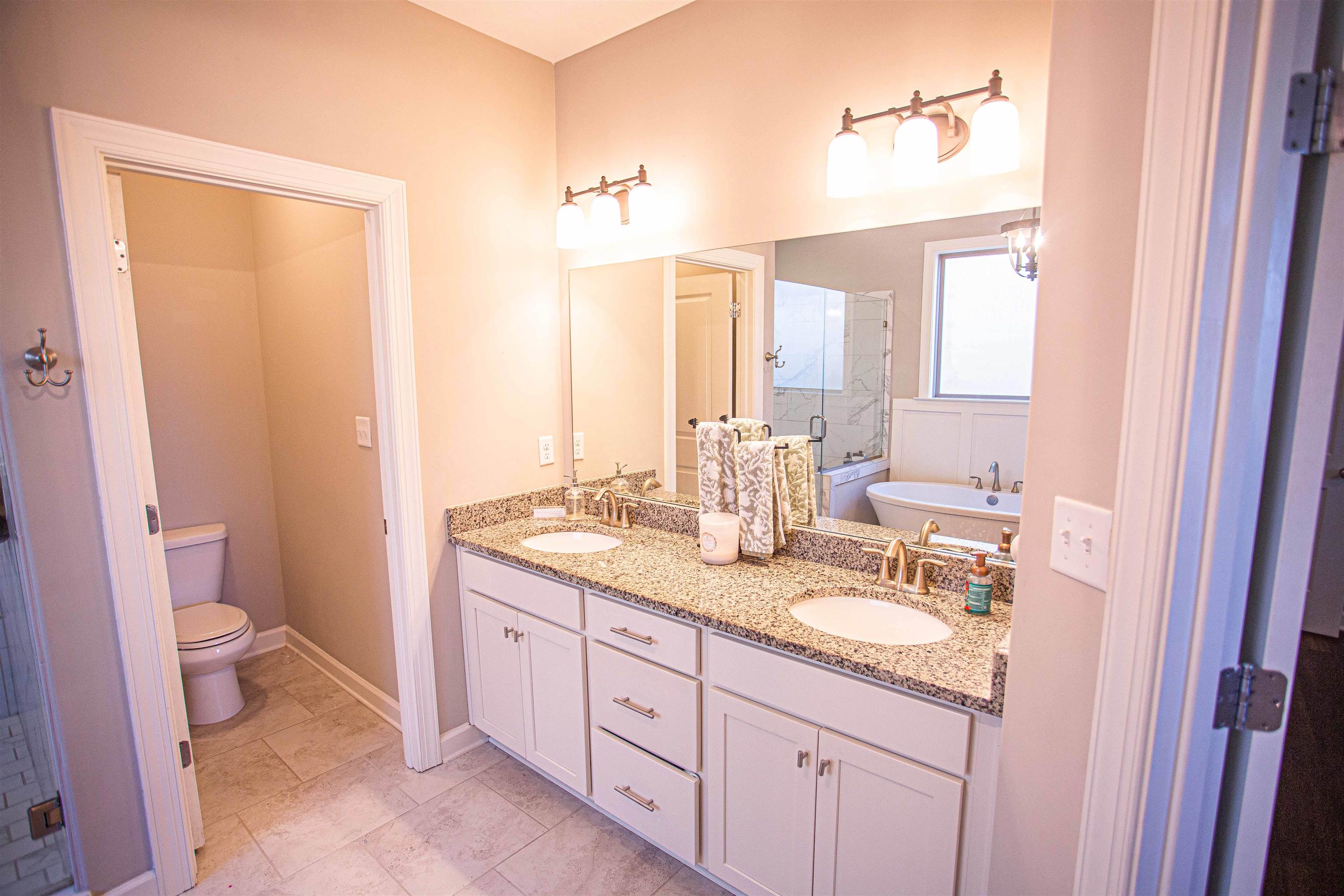 6314 Burren Way Arlington, TN 38002 - Photo 12 of 25 a bathroom with a granite countertop sink toilet and shower