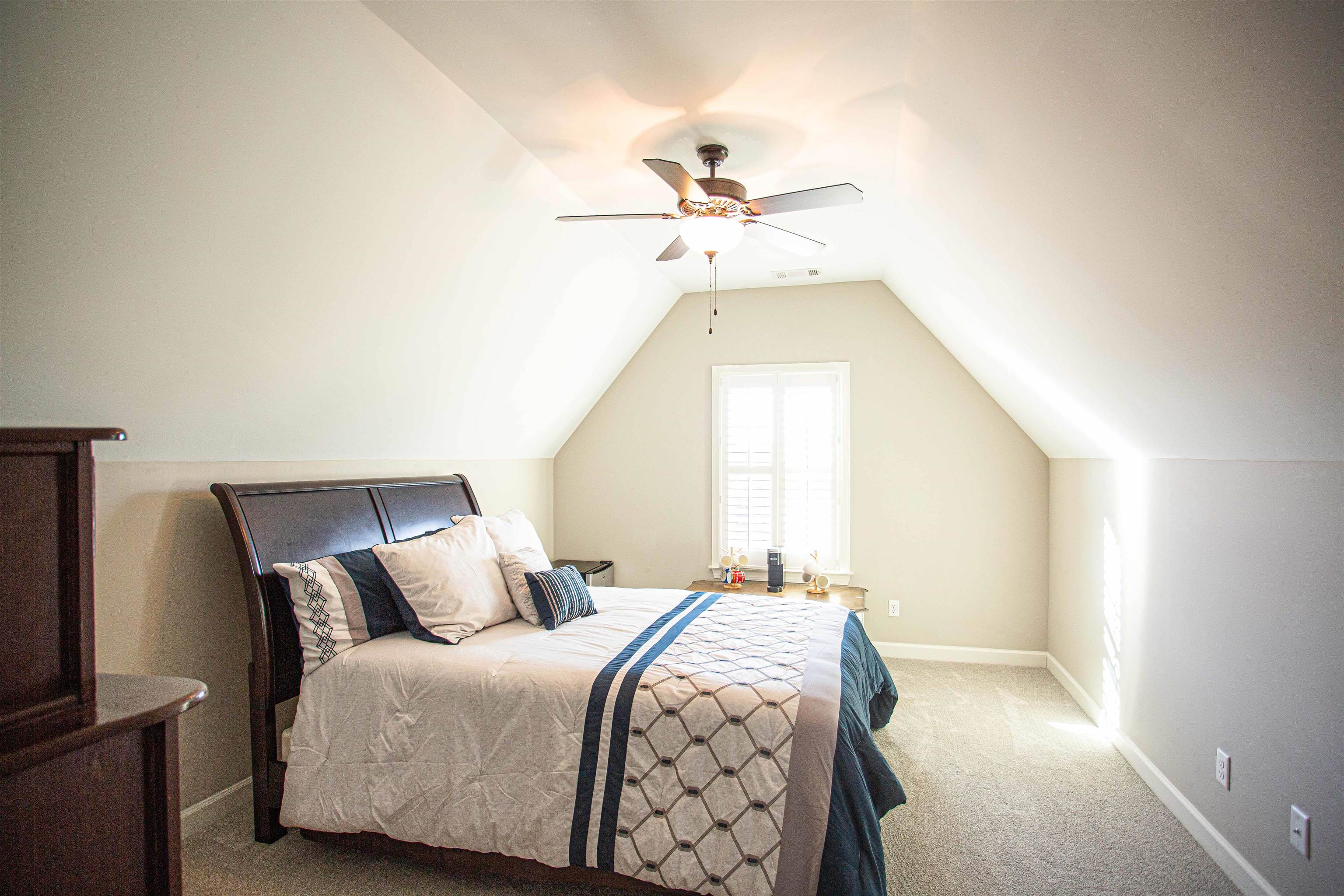 6314 Burren Way Arlington, TN 38002 - Photo 17 of 25 a bedroom with a bed and a window