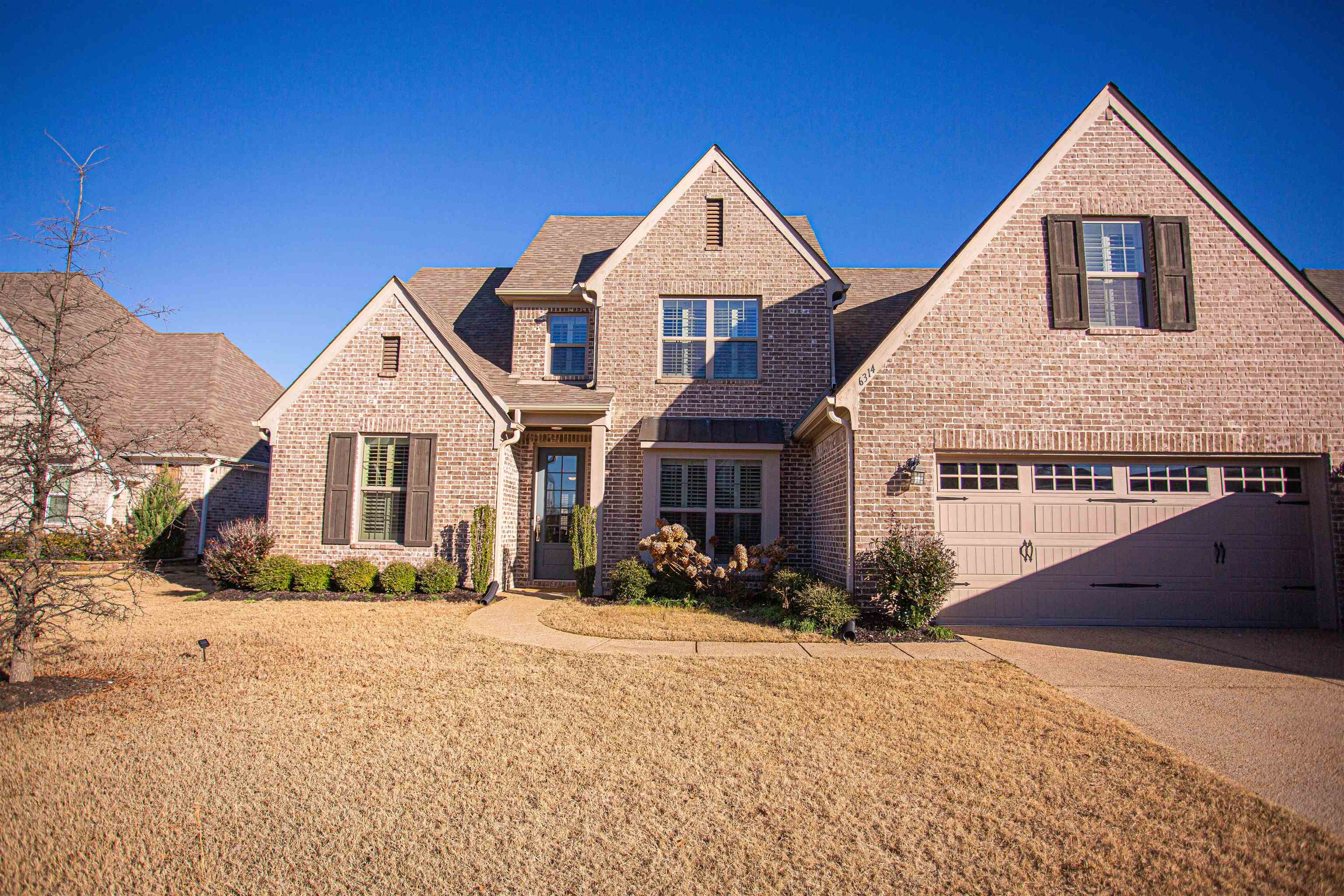 6314 Burren Way Arlington, TN 38002 - Photo 24 of 25 a front view of a house with a yard