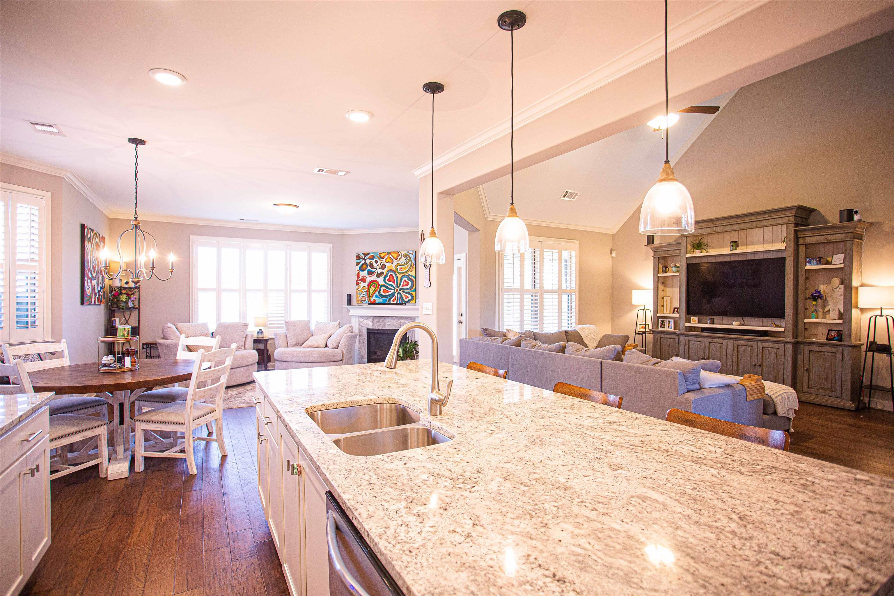 6314 Burren Way Arlington, TN 38002 - Photo 3 of 25 a large kitchen with kitchen island a stove a sink a oven a dining table and chairs