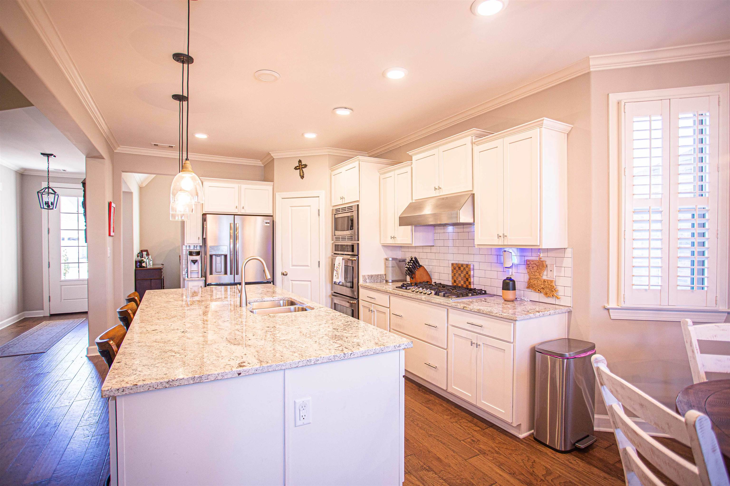 6314 Burren Way Arlington, TN 38002 - Photo 4 of 25 a kitchen with stainless steel appliances kitchen island granite countertop a sink and cabinets