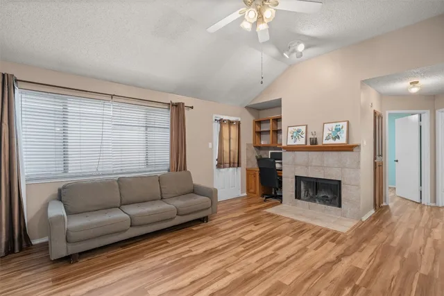 a living room with furniture and a fireplace