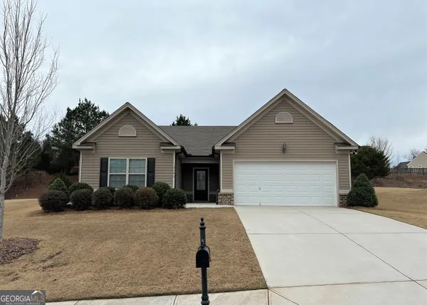 a front view of a house with yard