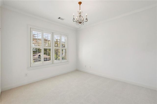 a bathroom with a granite countertop sink a toilet and a mirror