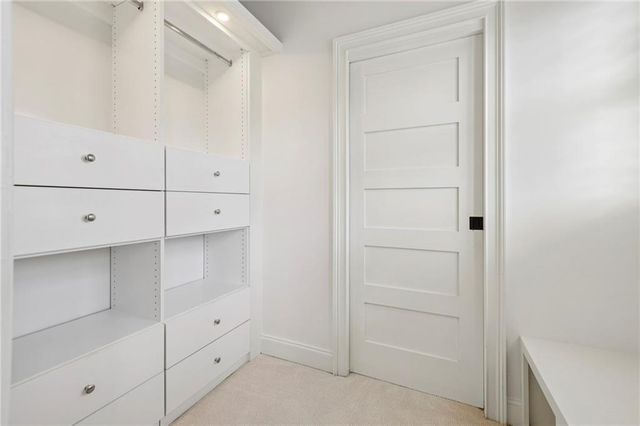 an empty room with windows and garden