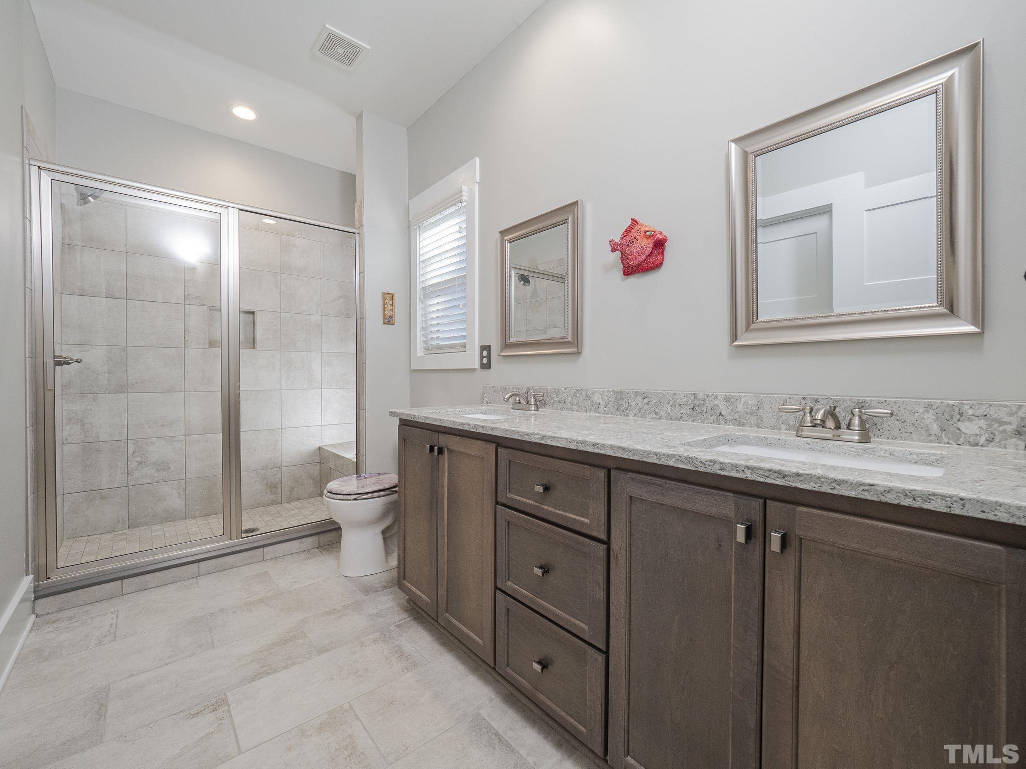 137 Bella Square Smithfield, NC 27577 - Photo 12 of 29 a bathroom with a granite countertop sink mirror and toilet