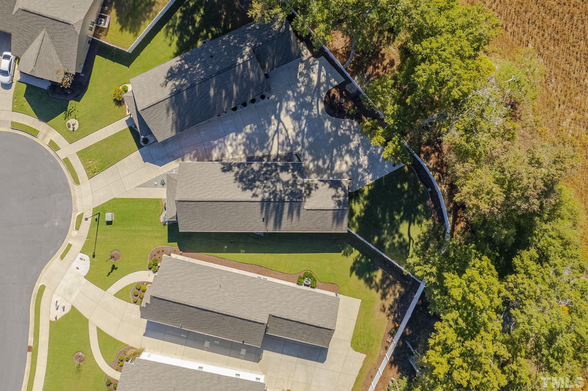 137 Bella Square Smithfield, NC 27577 - Photo 26 of 29 a view of swimming pool with seating area and trees in the background