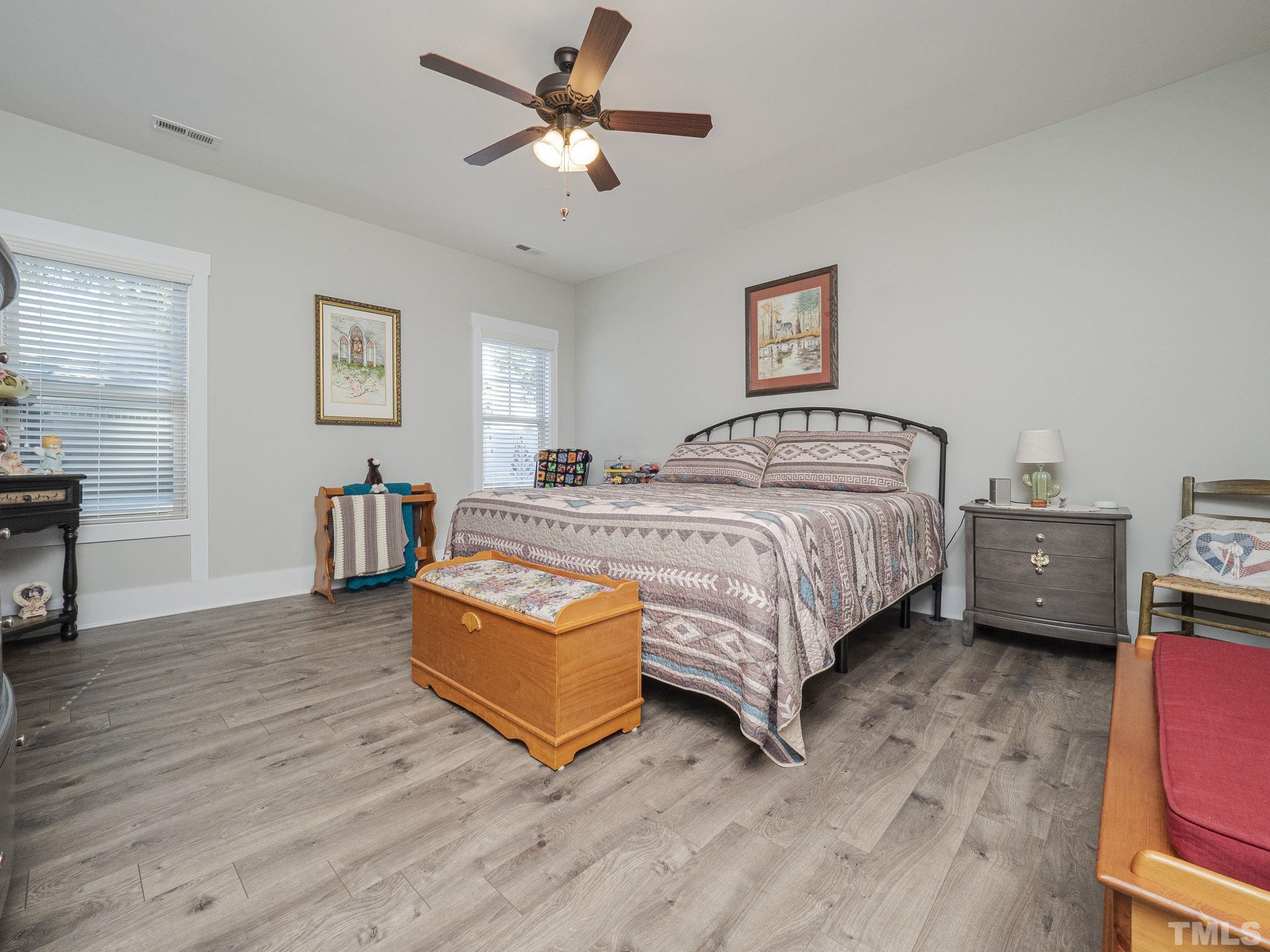 137 Bella Square Smithfield, NC 27577 - Photo 10 of 29 a bedroom with a bed couch and a window