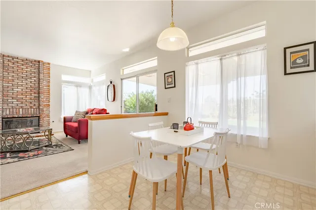 a living room with furniture rug and window