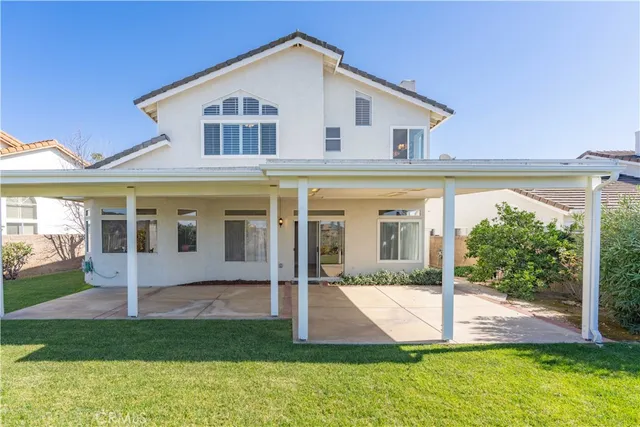 a view of a street with a cars parked in front of it