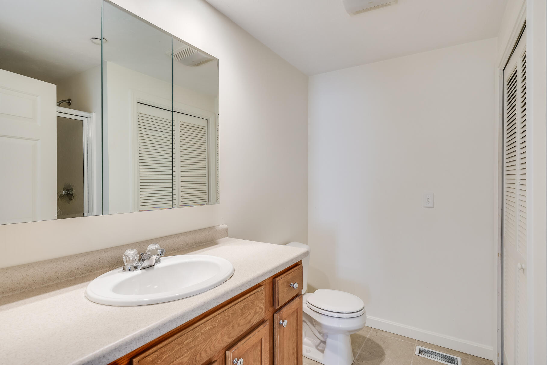 16 North Ridge Road Mashpee, MA 02649 - Photo 28 of 47 a bathroom with a sink a toilet and a mirror