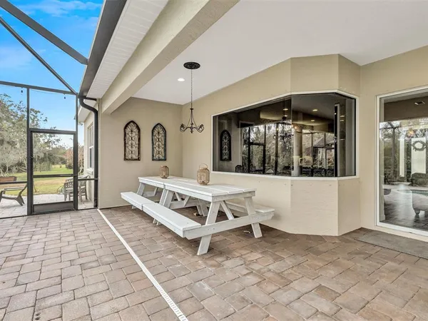 an aerial view of a house with a yard basket ball court and outdoor seating