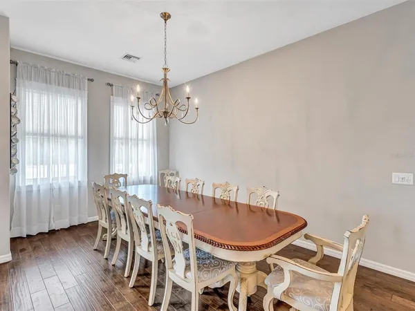 a dining room with furniture window wooden floor