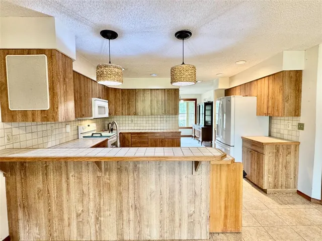 a bathroom with a toilet sink and shower