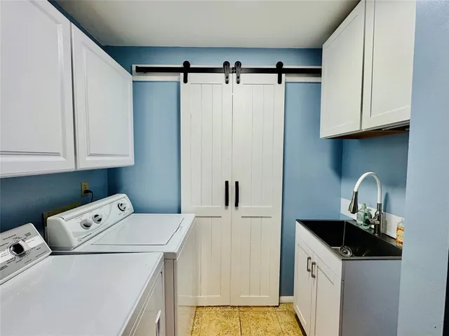 a view of a house with garden and plants