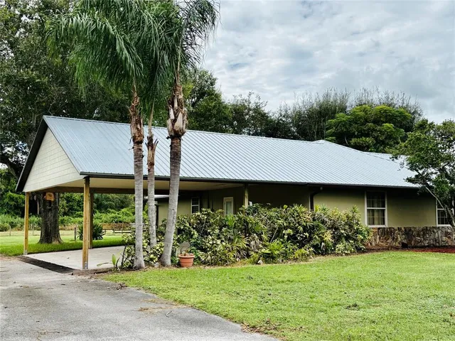 a view of a big room with furniture and windows
