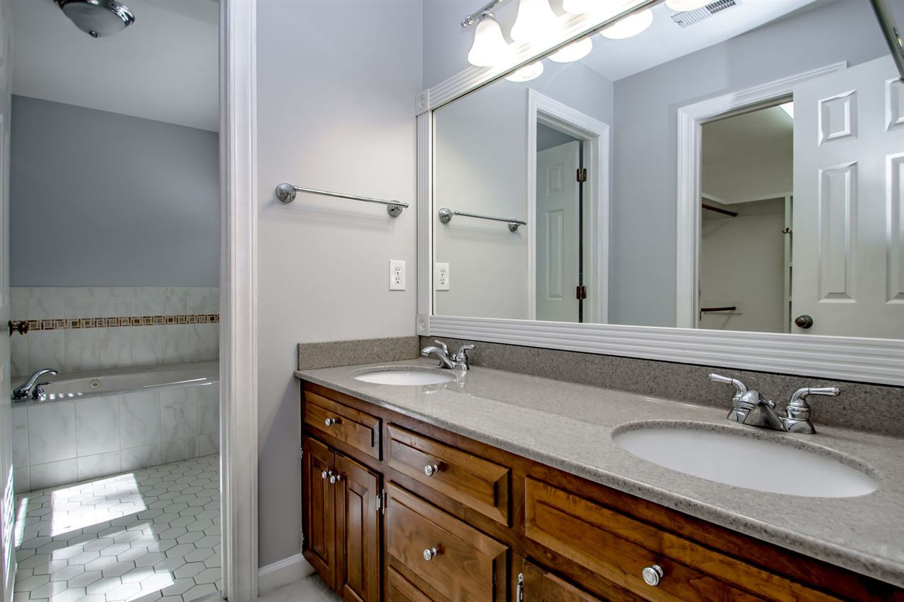 4609 Gramercy Court Raleigh, NC 27609 - Photo 14 of 22 The master bath features a double vanity, walk in closet, soaking tub and separate shower. Master Bath