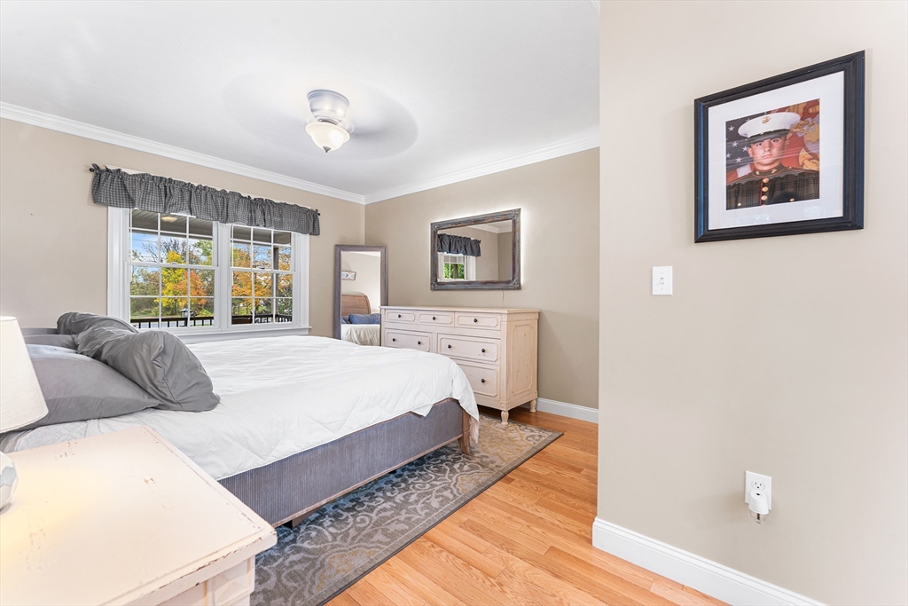 22 Washington Street Mendon, MA 01756 - Photo 11 of 31 a bedroom with a large bed and a window