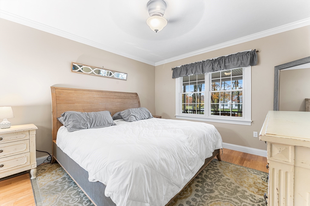22 Washington Street Mendon, MA 01756 - Photo 12 of 31 a bedroom with a large bed and a window