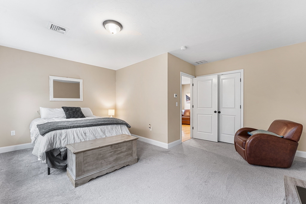 22 Washington Street Mendon, MA 01756 - Photo 15 of 31 a bedroom with a bed and a couch