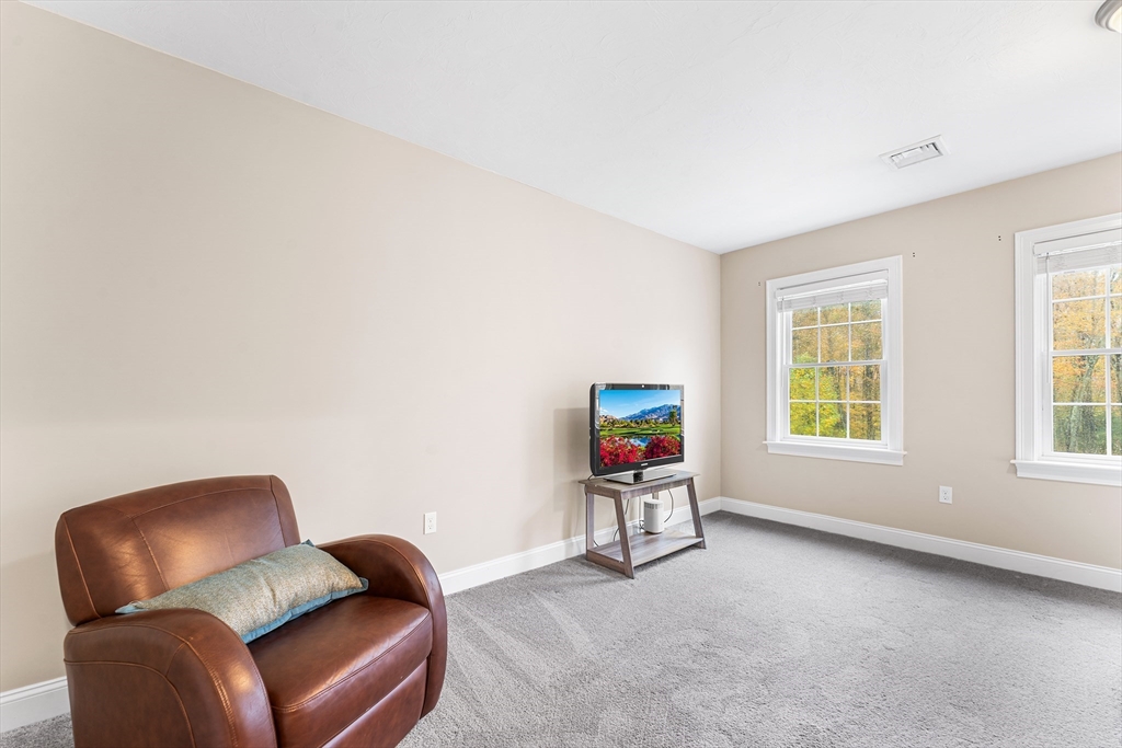 22 Washington Street Mendon, MA 01756 - Photo 16 of 31 a living room with furniture and a window