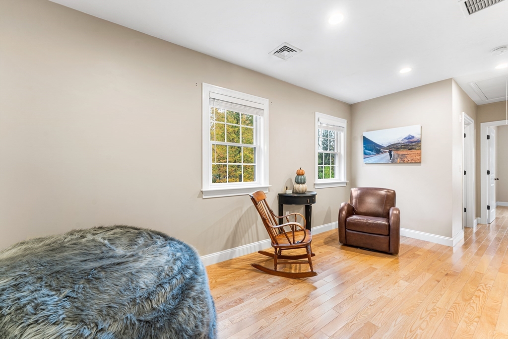 22 Washington Street Mendon, MA 01756 - Photo 19 of 31 a living room with furniture and a window