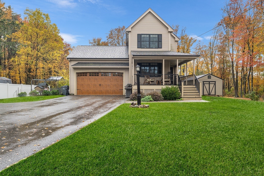 22 Washington Street Mendon, MA 01756 - Photo 2 of 31 a front view of a house with a garden