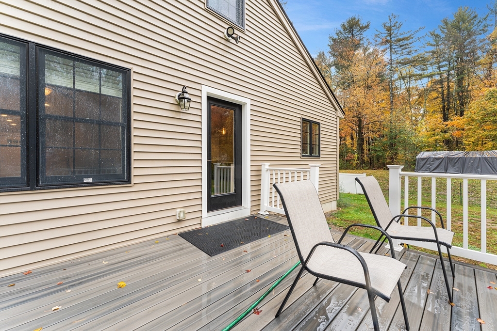 22 Washington Street Mendon, MA 01756 - Photo 25 of 31 a view of a house with backyard and sitting area