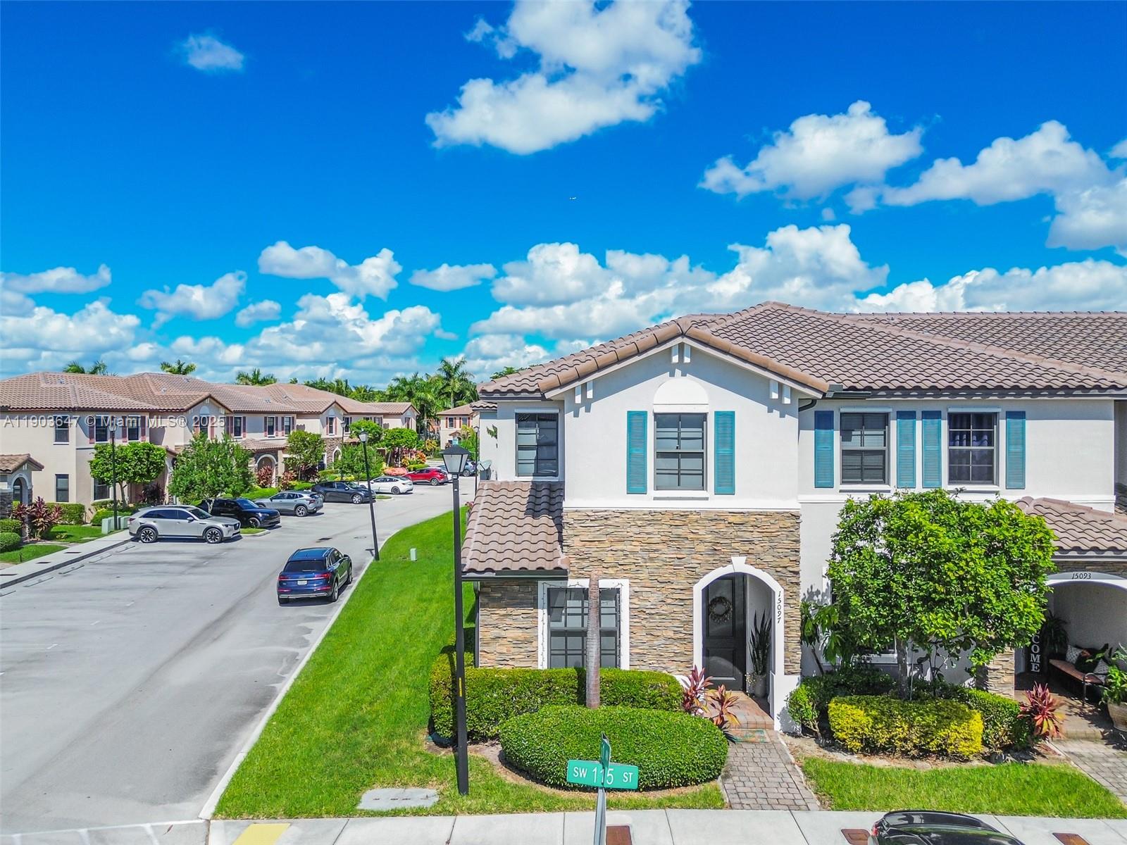 15097 Southwest 115th Street Miami, FL 33196 - Photo 1 of 44 a front view of a house with garden