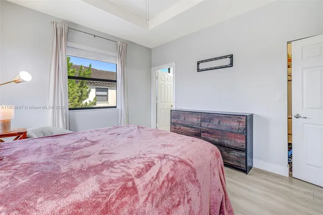 a bed room with a bed and a window