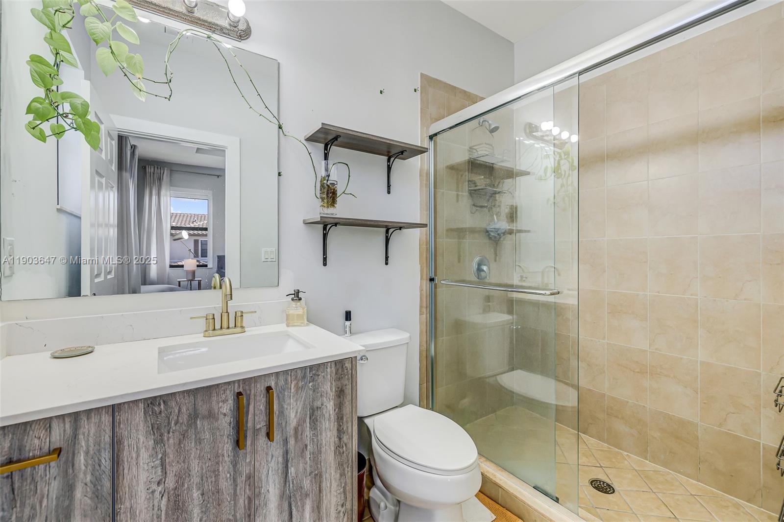 15097 Southwest 115th Street Miami, FL 33196 - Photo 22 of 44 a bathroom with a sink and a mirror