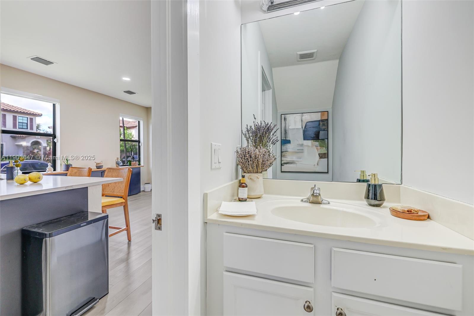 15097 Southwest 115th Street Miami, FL 33196 - Photo 24 of 44 a bathroom with a sink and a mirror