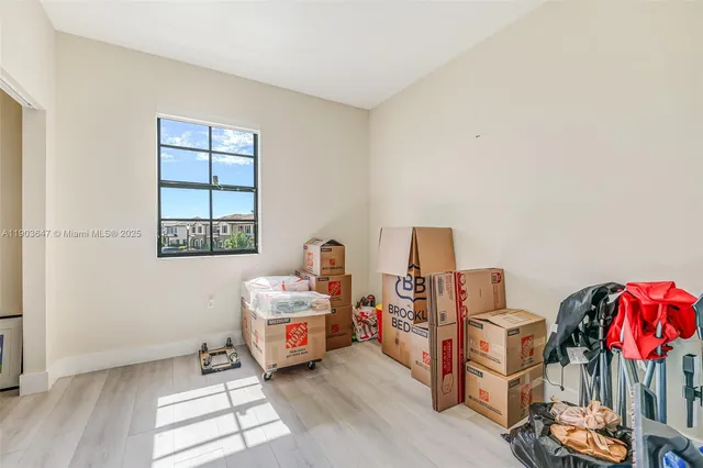 a bedroom with furniture and a window