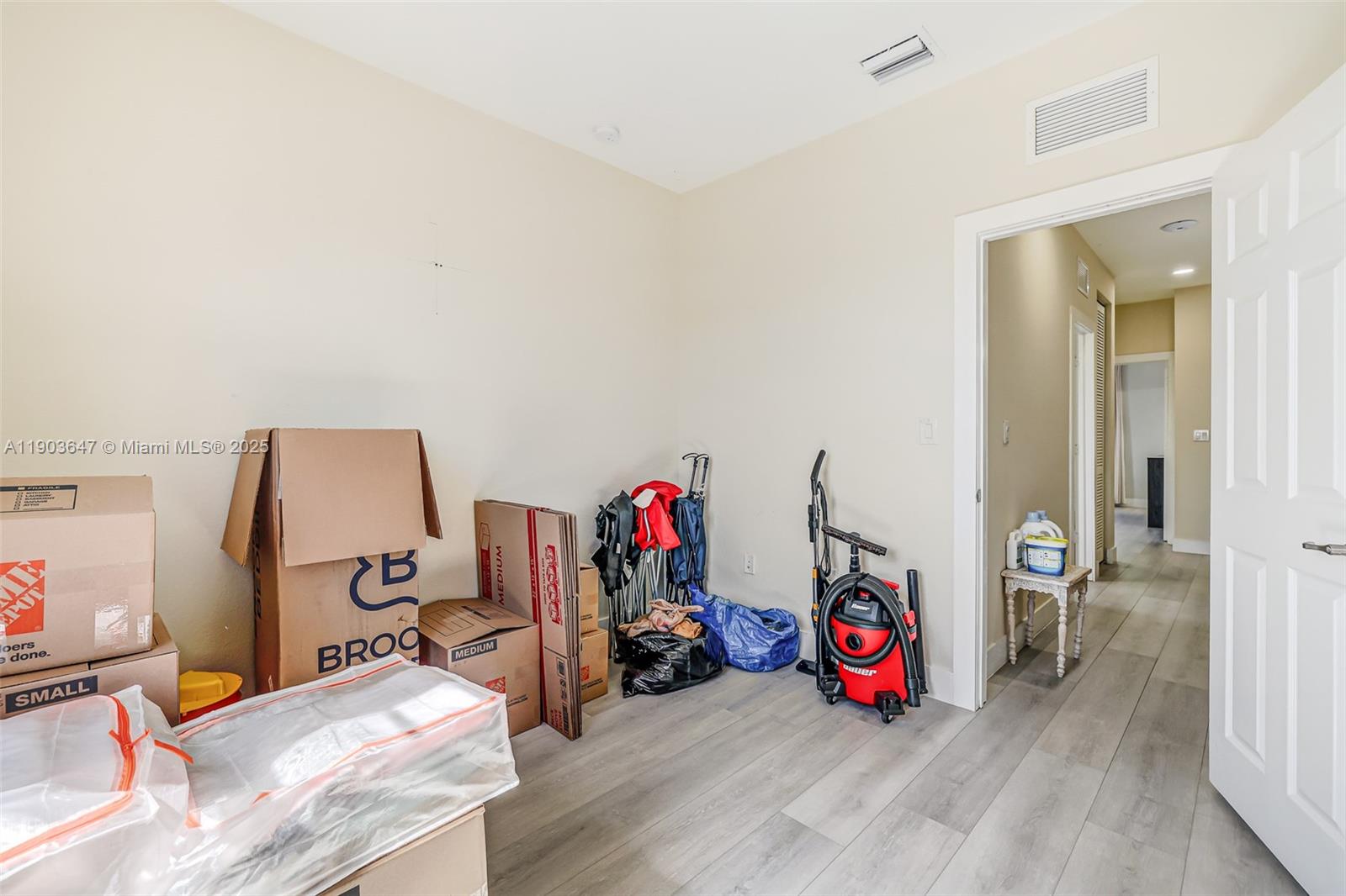 15097 Southwest 115th Street Miami, FL 33196 - Photo 26 of 44 a view of a room with wooden floor and furniture