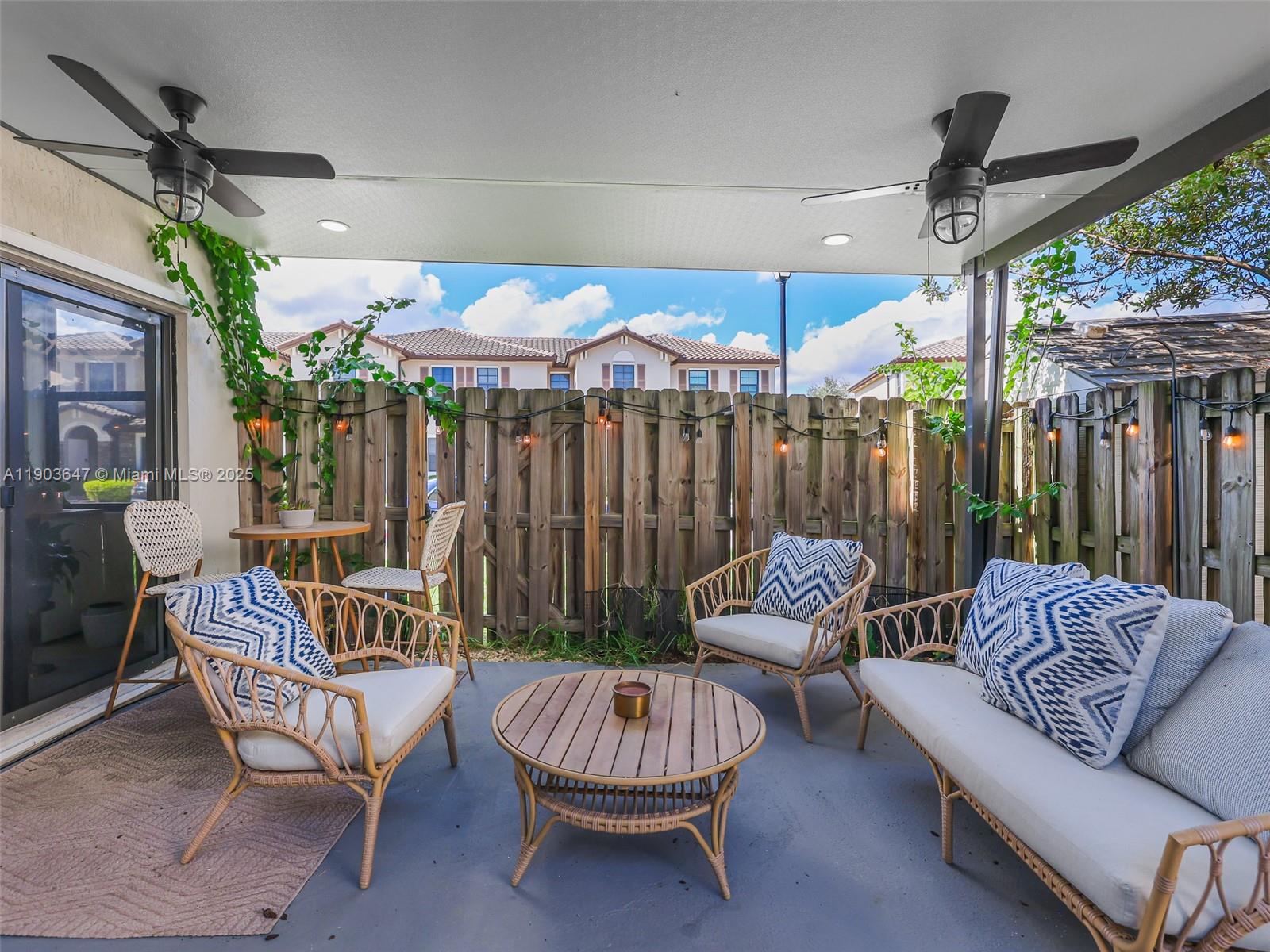 15097 Southwest 115th Street Miami, FL 33196 - Photo 27 of 44 a outdoor living space with furniture and a large window