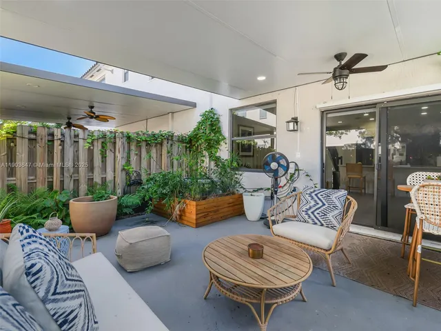 a outdoor living space with furniture and a potted plant