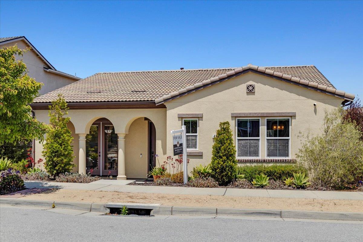 front view of a house with a cars