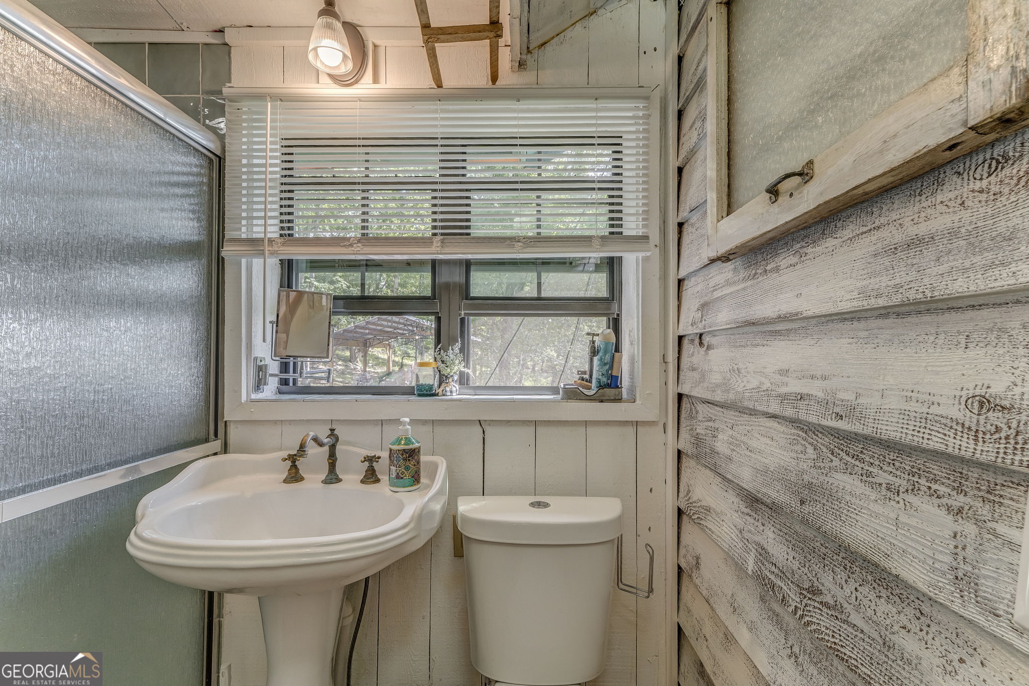 7896 Old State Road Menlo, GA 30731 - Photo 34 of 79 a bathroom with a sink a toilet and a mirror