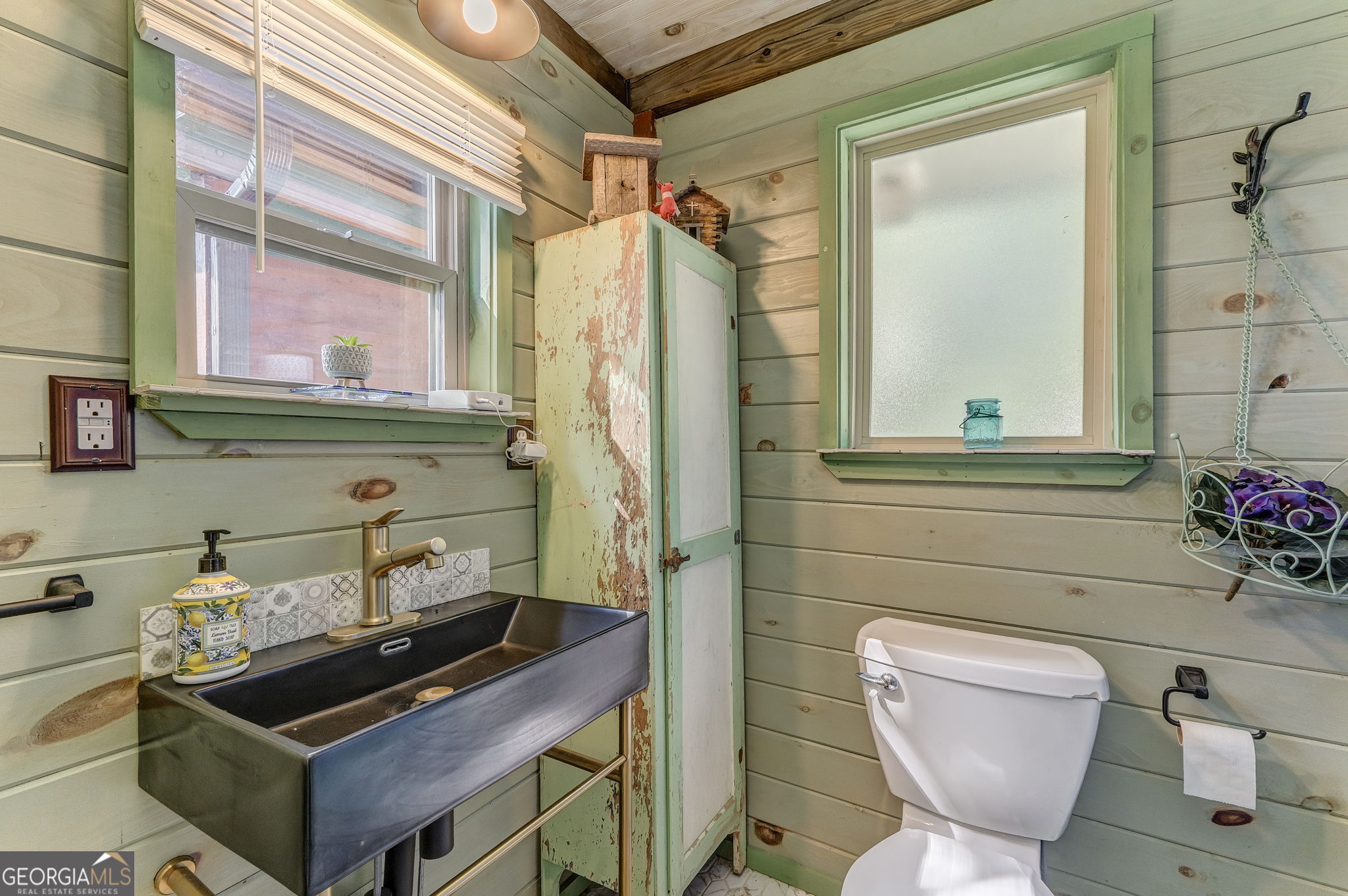 7896 Old State Road Menlo, GA 30731 - Photo 58 of 79 a bathroom with a toilet a sink and a mirror